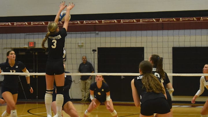 Assumption High School sophomore Julia Lee goes up for a block Oct. 14, 2025 against Notre Dame Academy.