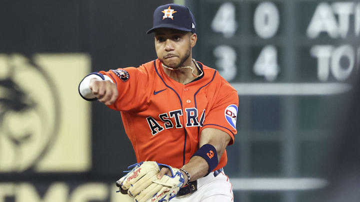 Mar 27, 2026; Houston, Texas, USA; Los Angeles Angels center fielder Mike Trout (27) is out as Houston Astros shortstop Jeremy Pena (3) throws to first base to complete a double play during the first inning at Daikin Park. Mandatory Credit: Troy Taormina-Imagn Images