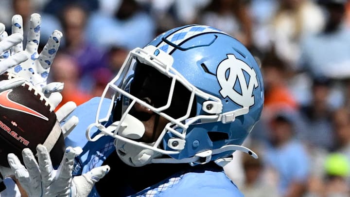 Oct 4, 2025; Chapel Hill, North Carolina, USA; Clemson Tigers wide receiver Bryant Wesco Jr. (12) attempts to catch a pass in the end zone as North Carolina Tar Heels defensive back Marcus Allen (29) defends in the first quarter at Kenan Stadium. Mandatory Credit: Bob Donnan-Imagn Images