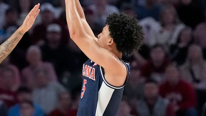 Dec 13, 2025; Birmingham, AL, USA; Arizona guard Brayden Burries (5) shoots a three over Alabama guard Houston Mallette (95) at Legacy Arena. Mandatory Credit: Gary Cosby Jr.-Tuscaloosa News Dec 13, 2025; Birmingham, AL, USA; Arizona guard Brayden Burries (5) shoots a three over Alabama guard Houston Mallette (95) at Legacy Arena. Mandatory Credit: Gary Cosby Jr.-Tuscaloosa News