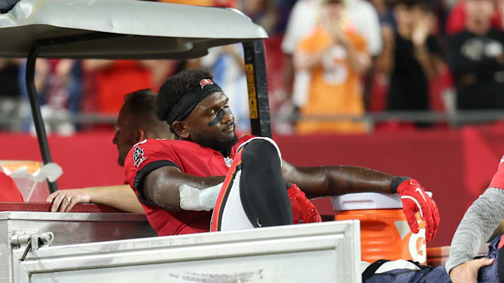 Oct 21, 2024; Tampa, Florida, USA; Tampa Bay Buccaneers wide receiver Chris Godwin (14) is carted off the field against the Baltimore Ravens in the fourth quarter at Raymond James Stadium. Mandatory Credit: Nathan Ray Seebeck-Imagn Images