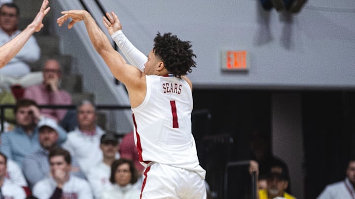 Feb 22, 2025; Tuscaloosa, Alabama, USA; Alabama Crimson Tide guard Mark Sears (1) attempts a three point basket against Kentucky Wildcats forward Andrew Carr (7) during the second half at Coleman Coliseum. Mandatory Credit: Will McLelland-Imagn Images