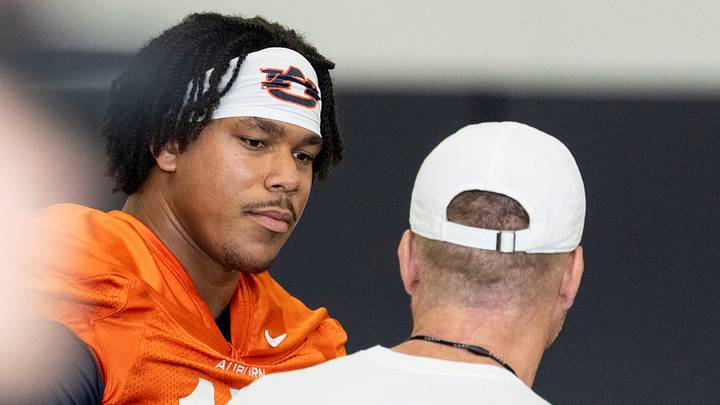 Auburn Tigers quarterback Byrum Brown (17) talks with head coach Alex Golesh during the first day of football practice at the Woltosz Football Performance Center in Auburn, Ala. on Wednesday, Aug. 5, 2026.