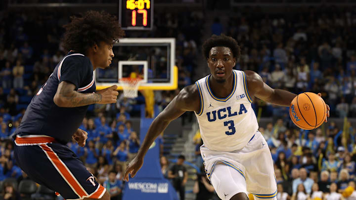 Nov 7, 2025; Los Angeles, California, USA;  UCLA Bruins forward Eric Dailey Jr. (3) dribbles the ball against Pepperdine Waves guard Aaron Clark (3) during the second half at Pauley Pavilion presented by Wescom Financial. Mandatory Credit: Kiyoshi Mio-Imagn Images