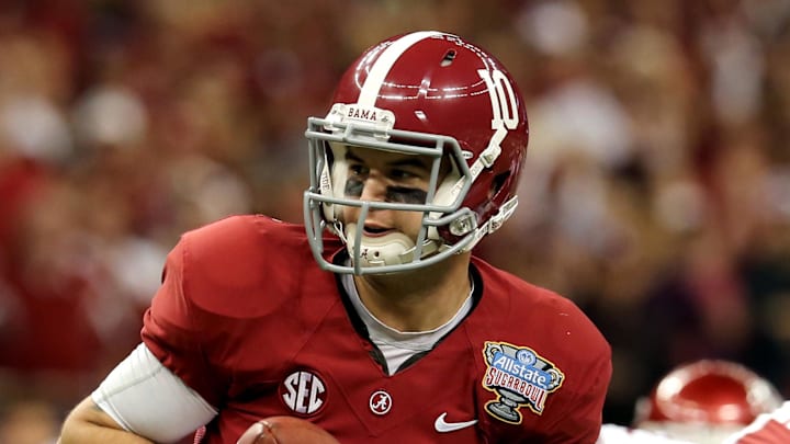 Jan 2, 2014; New Orleans, LA, USA; Alabama Crimson Tide quarterback AJ McCarron (10) looks to hand the ball off against the Oklahoma Sooners during the second half of the Sugar Bowl at the Mercedes-Benz Superdome. Oklahoma won, 45-31. Mandatory Credit: Chuck Cook-Imagn Images