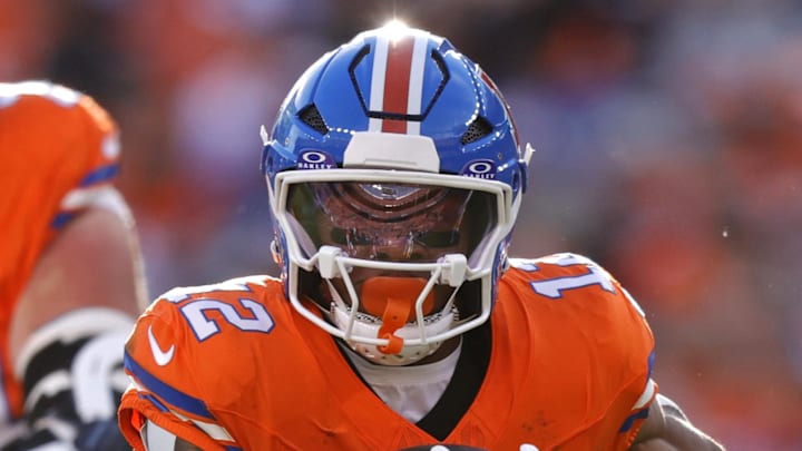 Jan 4, 2026; Denver, Colorado, USA; Denver Broncos running back RJ Harvey (12) runs with the ball against the Los Angeles Chargers during the first half at Empower Field at Mile High. Mandatory Credit: Isaiah J. Downing-Imagn Images