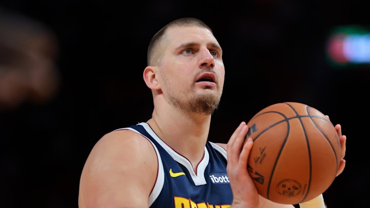 Dec 29, 2025; Miami, Florida, USA; Denver Nuggets center Nikola Jokic (15) shoots a free throw against the Miami Heat during the first quarter at Kaseya Center.