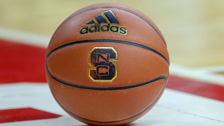 Feb 20, 2019; Raleigh, NC, USA; Basketball with the North Carolina State Wolfpack logo sits on the court during a timeout as the Wolfpack play the Boston College Eagles in the first half at PNC Arena. The North Carolina State Wolfpack won 89-80. Mandatory Credit: Nell Redmond-Imagn Images