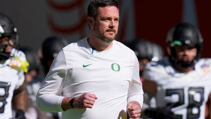 Oregon head coach Dan Lanning takes the field with his team for warmups as the Oregon Ducks take on the Texas Tech Red Raiders in the Orange Bowl on Jan. 1, 2026, at Hard Rock Stadium in Miami, Florida. Oregon head coach Dan Lanning takes the field with his team for warmups as the Oregon Ducks take on the Texas Tech Red Raiders in the Orange Bowl on Jan. 1, 2026, at Hard Rock Stadium in Miami, Florida.
