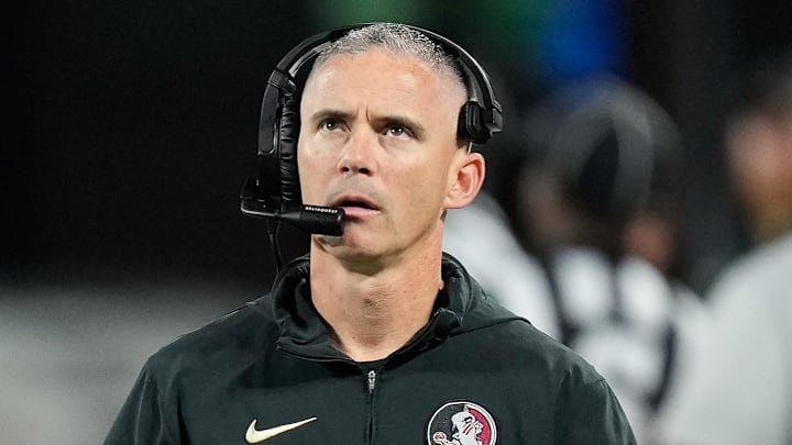 Dec 2, 2023; Charlotte, NC, USA;  Florida State Seminoles head coach Mike Norvell walks the sidelines during the third quarter against the Louisville Cardinals at Bank of America Stadium. Mandatory Credit: Jim Dedmon-Imagn Images