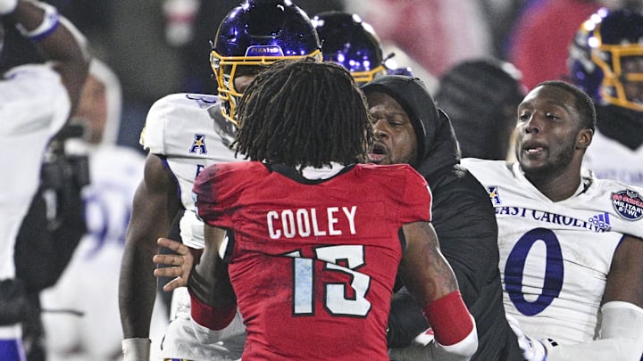 Dec 28, 2024; Annapolis, MD, USA; North Carolina State Wolfpack and East Carolina Pirates players fight during the second half of the Go Bowling Military Bowl at Navy-Marine Corps Memorial Stadium. Mandatory Credit: Tommy Gilligan-Imagn Images Dec 28, 2024; Annapolis, MD, USA; North Carolina State Wolfpack and East Carolina Pirates players fight during the second half of the Go Bowling Military Bowl at Navy-Marine Corps Memorial Stadium. Mandatory Credit: Tommy Gilligan-Imagn Images