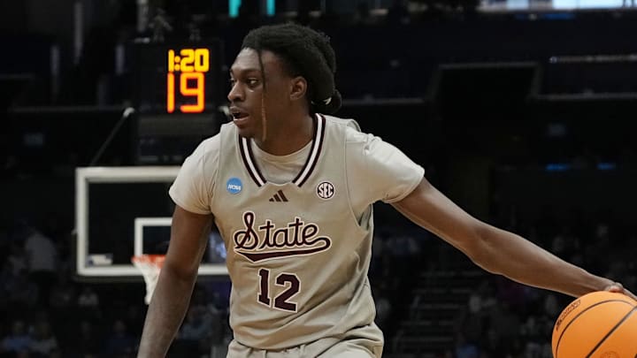 March 21, 2024, Charlotte, NC, USA; Mississippi State Bulldogs forward KeShawn Murphy (12) is defended by Michigan State Spartans forward Malik Hall (25) in the first round of the 2024 NCAA Tournament at the Spectrum Center. Mandatory Credit: Jim Dedmon-Imagn Images