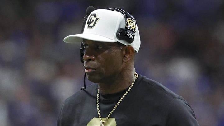 Dec 28, 2024; San Antonio, TX, USA; Colorado Buffaloes head coach Deion Sanders walks on the field during the game against the Brigham Young Cougars at Alamodome.