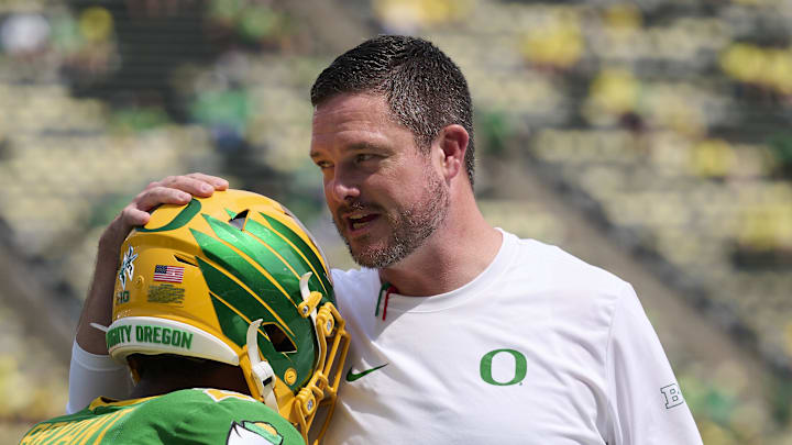 Aug 30, 2025; Eugene, Oregon, USA; Oregon Ducks head coach Dan Lanning talks to wide receiver Gary Bryant Jr. (2) during warm ups before a game against the Montana State Bobcats at Autzen Stadium. Mandatory Credit: Troy Wayrynen-Imagn Images
