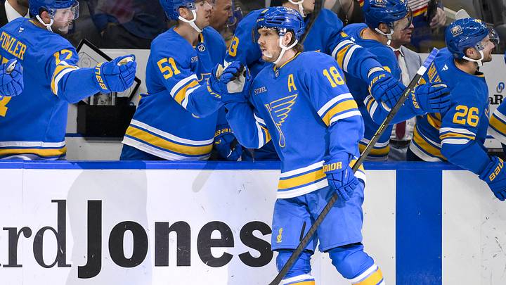Nov 14, 2025; St. Louis, Missouri, USA; St. Louis Blues center Robert Thomas (18) is congratulated by teammates after scoring against the Philadelphia Flyers during the third period at Enterprise Center. 