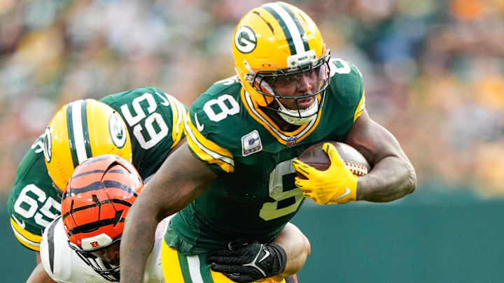 Green Bay Packers running back Josh Jacobs (8) runs with the ball in the third quarter against the Cincinnati Bengals at Lambeau Field. 