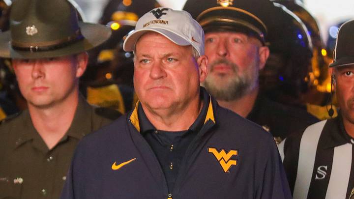 Sep 26, 2026; Morgantown, West Virginia, USA; West Virginia Mountaineers head coach Rich Rodriguez leads his team onto the field prior to their game against the Oklahoma State Cowboys at Milan Puskar Stadium. Mandatory Credit: Ben Queen-Imagn Images