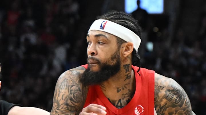 Toronto Raptors forward Brandon Ingram dribbles the ball past Cleveland Cavaliers guard Sam Merrill.