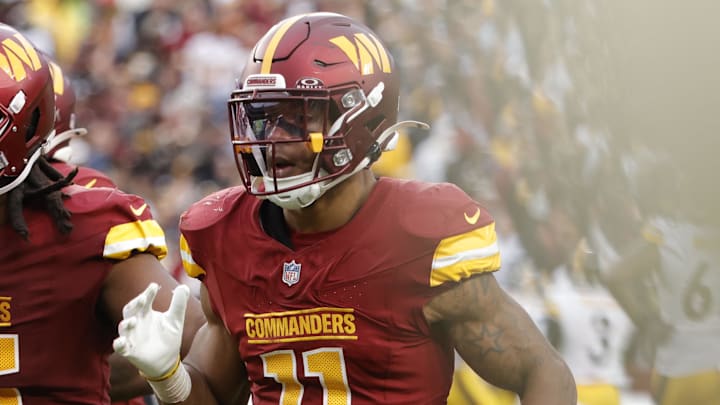 Nov 10, 2024; Landover, Maryland, USA; Washington Commanders safety Jeremy Chinn (11) celebrates after intercepting a pass against the Pittsburgh Steelers during the second half at Northwest Stadium. Mandatory Credit: Amber Searls-Imagn Images