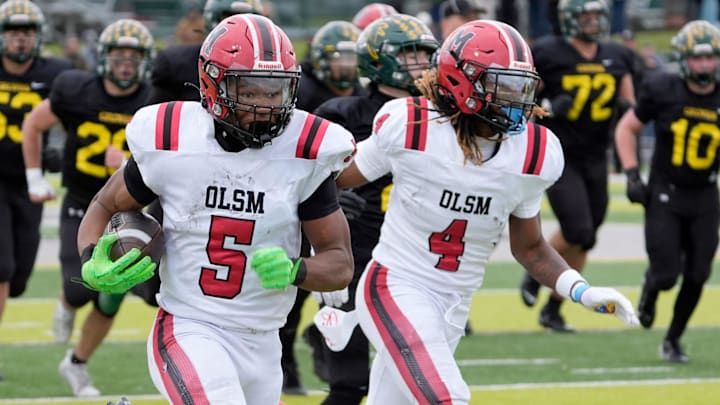 Orchard Lake St. Mary’s running back Darrin Jones runs to the end zone trailed by teammate Bryson Williams during the first half in the MHSAA Division 2 semifinal game at West Bloomfield High School on Saturday, Nov. 23, 2024. St. Mary’s defeated Birmingham Groves 28-27 in overtime.