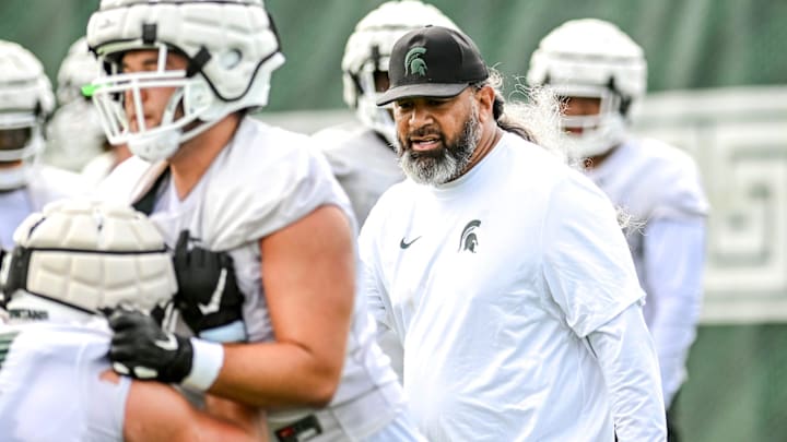 Michigan State's defensive line coach Legi Suiaunoa works with players during the first day of football camp on Tuesday, July 30, 2024, in East Lansing. Michigan State's defensive line coach Legi Suiaunoa works with players during the first day of football camp on Tuesday, July 30, 2024, in East Lansing.