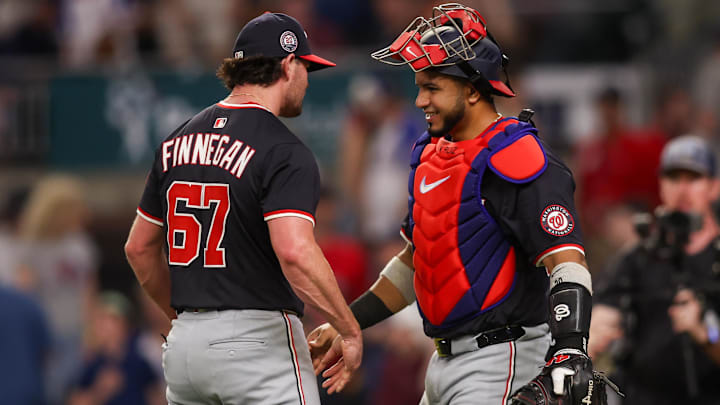 May 14, 2025; Atlanta, Georgia, USA; Washington Nationals relief pitcher Kyle Finnegan (67) and catcher Keibert Ruiz (20) celebrate after a victory over the Atlanta Braves at Truist Park