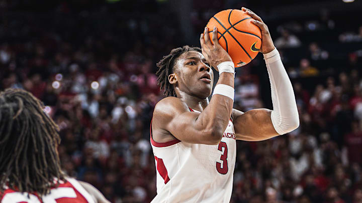Adou Thiero (3) shoots a three against the Oklahoma Sooners inside Bud Walton Arena. The Sooners won 65-62.
