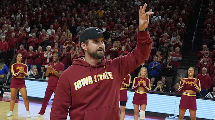 Iowa State football coach Jimmy Rogers speaks during a timeout in the first half in the Iowa State and Iowa men’s basketball Cy-Hawk series at Hilton coliseum on Dec. 11, 2025, in Ames, Iowa. Iowa State football coach Jimmy Rogers speaks during a timeout in the first half in the Iowa State and Iowa men’s basketball Cy-Hawk series at Hilton coliseum on Dec. 11, 2025, in Ames, Iowa.
