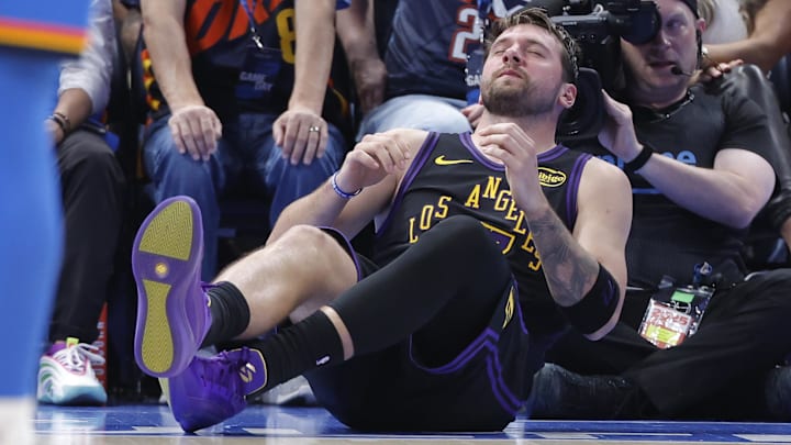 Apr 2, 2026; Oklahoma City, Oklahoma, USA; Los Angeles Lakers guard Luka Doncic (77) falls to the court during a play against the Oklahoma City Thunder during the third quarter at Paycom Center. Mandatory Credit: Alonzo Adams-Imagn Images