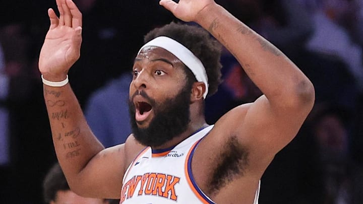 Feb 4, 2026; New York, New York, USA;  New York Knicks center Mitchell Robinson (23) reacts after getting called for a foul in the second overtime against the Denver Nuggets at Madison Square Garden. Mandatory Credit: Wendell Cruz-Imagn Images