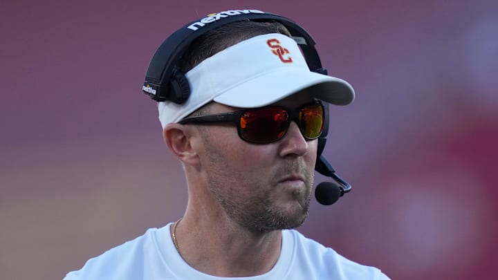 Oct 21, 2023; Los Angeles, California, USA; Southern California Trojans head coach Lincoln Riley watches from the sidelines against the Utah Utes in the first half at United Airlines Field at Los Angeles Memorial Coliseum. Mandatory Credit: Kirby Lee-Imagn Images