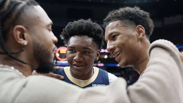 Mar 8, 2026; New Orleans, Louisiana, USA; Washington Wizards forward Cam Whitmore, left, chats with New Orleans Pelicans center Derik Queen, center, and forward Julian Reese (15) after a game at Smoothie King Center. Mandatory Credit: Matthew Hinton-Imagn Images