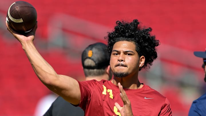 Sep 6, 2025; Los Angeles, California, USA;  USC Trojans quarterback Jayden Maiava (14) warms up prior to the game against the Georgia Southern Eagles at United Airlines Field at Los Angeles Memorial Coliseum. Mandatory Credit: Jayne Kamin-Oncea-Imagn Images