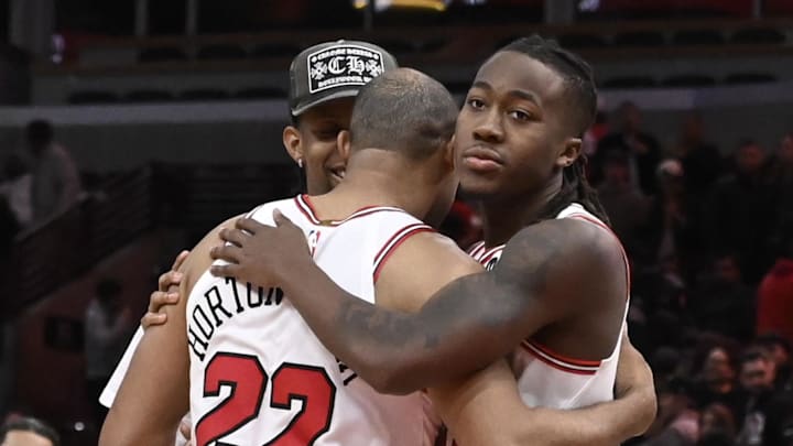Oct 18, 2024; Chicago, Illinois, USA;  Chicago Bulls forward Talen Horton-Tucker (22), guard Ayo Dosunmu (11) and forward Dalen Terry (25) hug after then game against the Cleveland Cavaliers at the United Center. Mandatory Credit: Matt Marton-Imagn Images