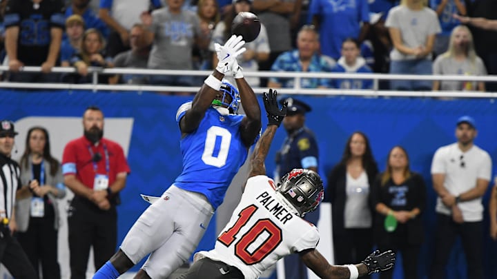 Detroit Lions cornerback Terrion Arnold (0) breaks up a pass intended for Buccaneers wide receiver Trey Palmer (10)