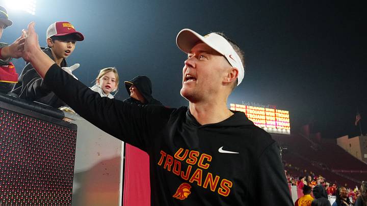 Southern California Trojans head coach Lincoln Riley celebrates with fans after the game against the UCLA Bruins at United Airlines Field at Los Angeles Memorial Coliseum. Southern California Trojans head coach Lincoln Riley celebrates with fans after the game against the UCLA Bruins at United Airlines Field at Los Angeles Memorial Coliseum.