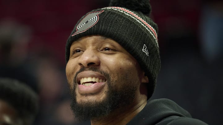 Nov 30, 2025; Portland, Oregon, USA; Portland Trail Blazers guard Damian Lillard (0) shares a laugh before a game against the Oklahoma City Thunder at Moda Center. Mandatory Credit: Troy Wayrynen-Imagn Images