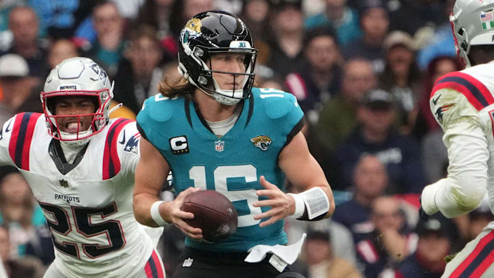Oct 20, 2024; London, United Kingdom; Jacksonville Jaguars quarterback Trevor Lawrence (16) prepares to throw the ball against the New England Patriots in the second half of an NFL International Series game at Wembley Stadium. Mandatory Credit: Kirby Lee-Imagn Images