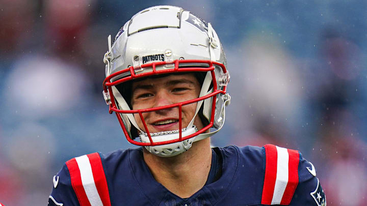 Dec 28, 2024; Foxborough, Massachusetts, USA; New England Patriots quarterback Drake Maye (10) and quarterback Jacoby Brissett (7) warm up before the start of the game against the Los Angeles Chargers at Gillette Stadium. Mandatory Credit: David Butler II-Imagn Images
