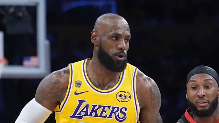 Apr 18, 2026; Los Angeles, California, USA; Los Angeles Lakers forward LeBron James (23) drives to the basket agianst Houston Rockets guard Josh Okogie (20) in the first half during game one of the first round of the 2026 NBA Playoffs at Crypto.com Arena. Mandatory Credit: Kirby Lee-Imagn Images