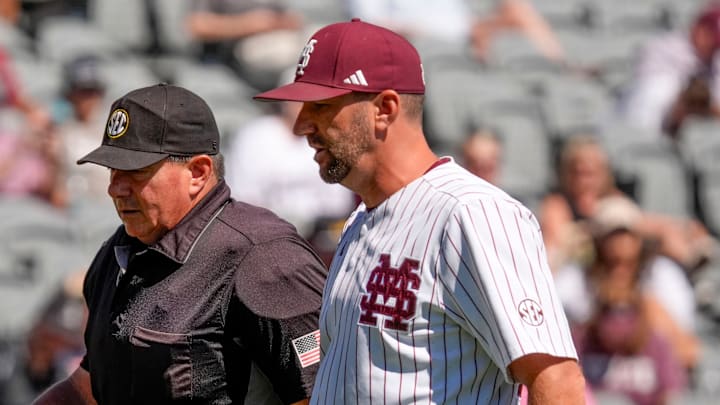 Mississippi State interim coach Justin Parker discusses things with home plate umpire David Savage during the game with Texas A&M in the first round of the SEC Baseball Tournament at the Hoover Met. Mississippi State interim coach Justin Parker discusses things with home plate umpire David Savage during the game with Texas A&M in the first round of the SEC Baseball Tournament at the Hoover Met.