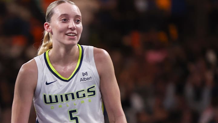Aug 29, 2025; College Park, Georgia, USA; Atlanta Dream guard Rhyne Howard (10) talks to Dallas Wings guard Paige Bueckers (5) in the second quarter at Gateway Center Arena at College Park. Mandatory Credit: Brett Davis-Imagn Images