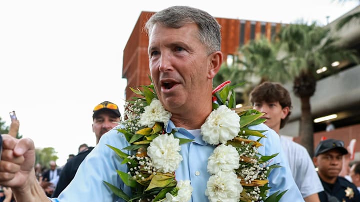 Aug 31, 2024; Tucson, Arizona, USA; Arizona Wildcat head coach Brent Brennan interacts with fans as he walks down the Wildcat Walk before a game against the New Mexico Lobos at Arizona Stadium Aug 31, 2024; Tucson, Arizona, USA; Arizona Wildcat head coach Brent Brennan interacts with fans as he walks down the Wildcat Walk before a game against the New Mexico Lobos at Arizona Stadium