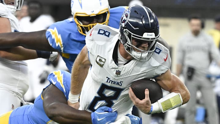 Nov 10, 2024; Inglewood, California, USA; Los Angeles Chargers defensive tackle Teair Tart (90) tackles Tennessee Titans quarterback Will Levis (8) during the third quarter at SoFi Stadium. Mandatory Credit: Robert Hanashiro-Imagn Images Nov 10, 2024; Inglewood, California, USA; Los Angeles Chargers defensive tackle Teair Tart (90) tackles Tennessee Titans quarterback Will Levis (8) during the third quarter at SoFi Stadium. Mandatory Credit: Robert Hanashiro-Imagn Images