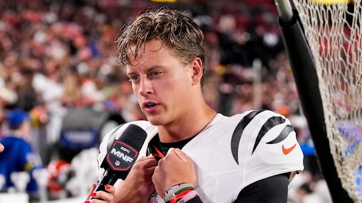 Cincinnati Bengals quarterback Joe Burrow (9) is interviewed by sideline reporter Laura Rutledge in the third quarter of the NFL Preseason Week 2 game between the Washington Commanders and the Cincinnati Bengals at Northwest Stadium in Landover, Md., on Monday, Aug. 18, 2025. The Bengals won the game, 31-17.