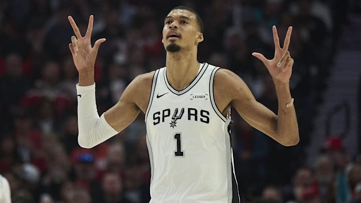 Apr 26, 2026; Portland, Oregon, USA; San Antonio Spurs forward Victor Wembanyama (1) celebrates a three point basket by guard De'aaron Fox (4) during the first half of game four of the first round of the 2026 NBA Playoffs against the Portland Trail Blazers at Moda Center. Mandatory Credit: Troy Wayrynen-Imagn Images