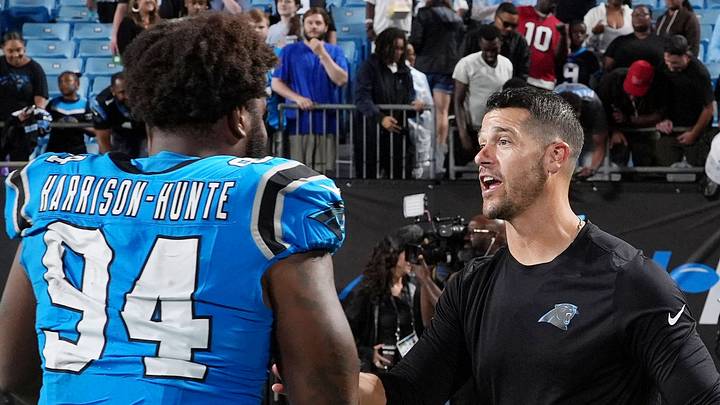 Carolina Panthers defensive lineman Jared Harrison-Hunte and head coach Dave Canales