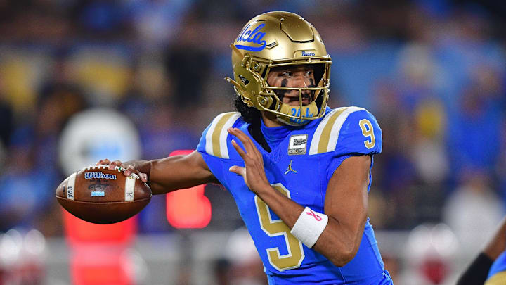 Nov 8, 2025; Pasadena, California, USA; UCLA Bruins quarterback Nico Iamaleava (9) throws against the Nebraska Cornhuskers during the first half at the Rose Bowl. Mandatory Credit: Gary A. Vasquez-Imagn Images