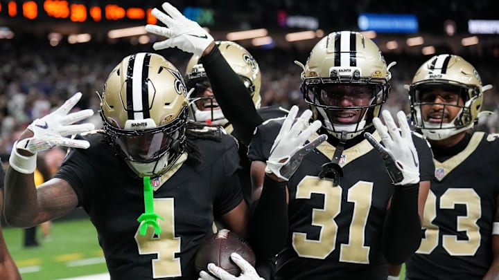 Oct 5, 2025; New Orleans, Louisiana, USA; New Orleans Saints cornerback Kool-Aid McKinstry (4) and New Orleans Saints safety Jordan Howden (31) celebrate after an interception against the New York Giants during the fourth quarter at Caesars Superdome. Mandatory Credit: Matthew Hinton-Imagn Images