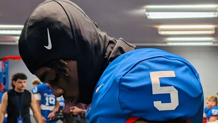 Reggie Hubbard III with his Cleveland High School jersey on in the weight room